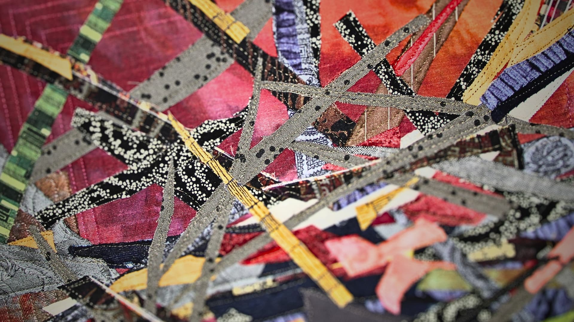 A close up of a textile art piece of an abstract nest